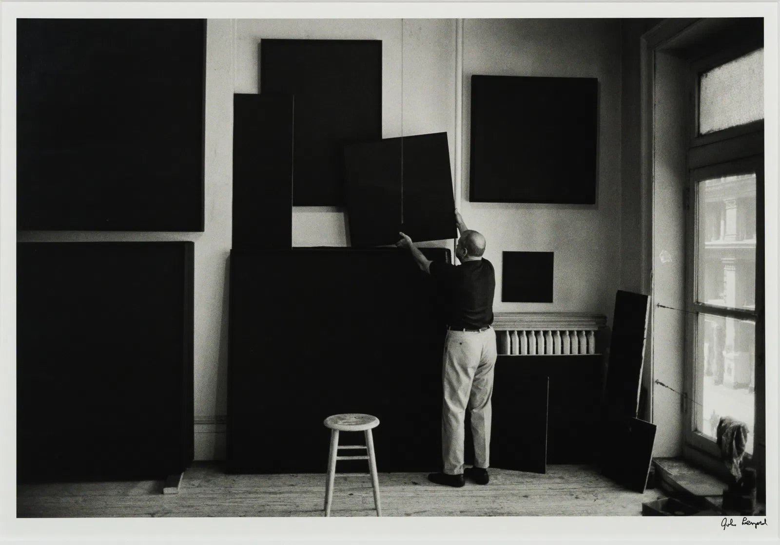 John Loengard: Ad Reinhardt Hangs Paintings to Dry, 1996