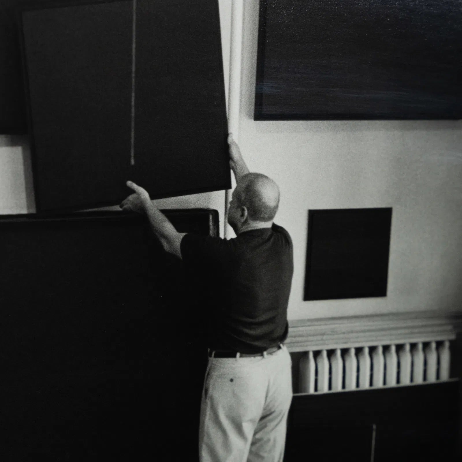 John Loengard: Ad Reinhardt Hangs Paintings to Dry, 1996