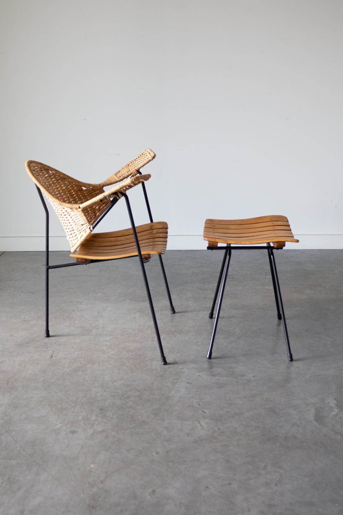 Cane and steel armchair and ottoman by Arthur Umanoff, 1955