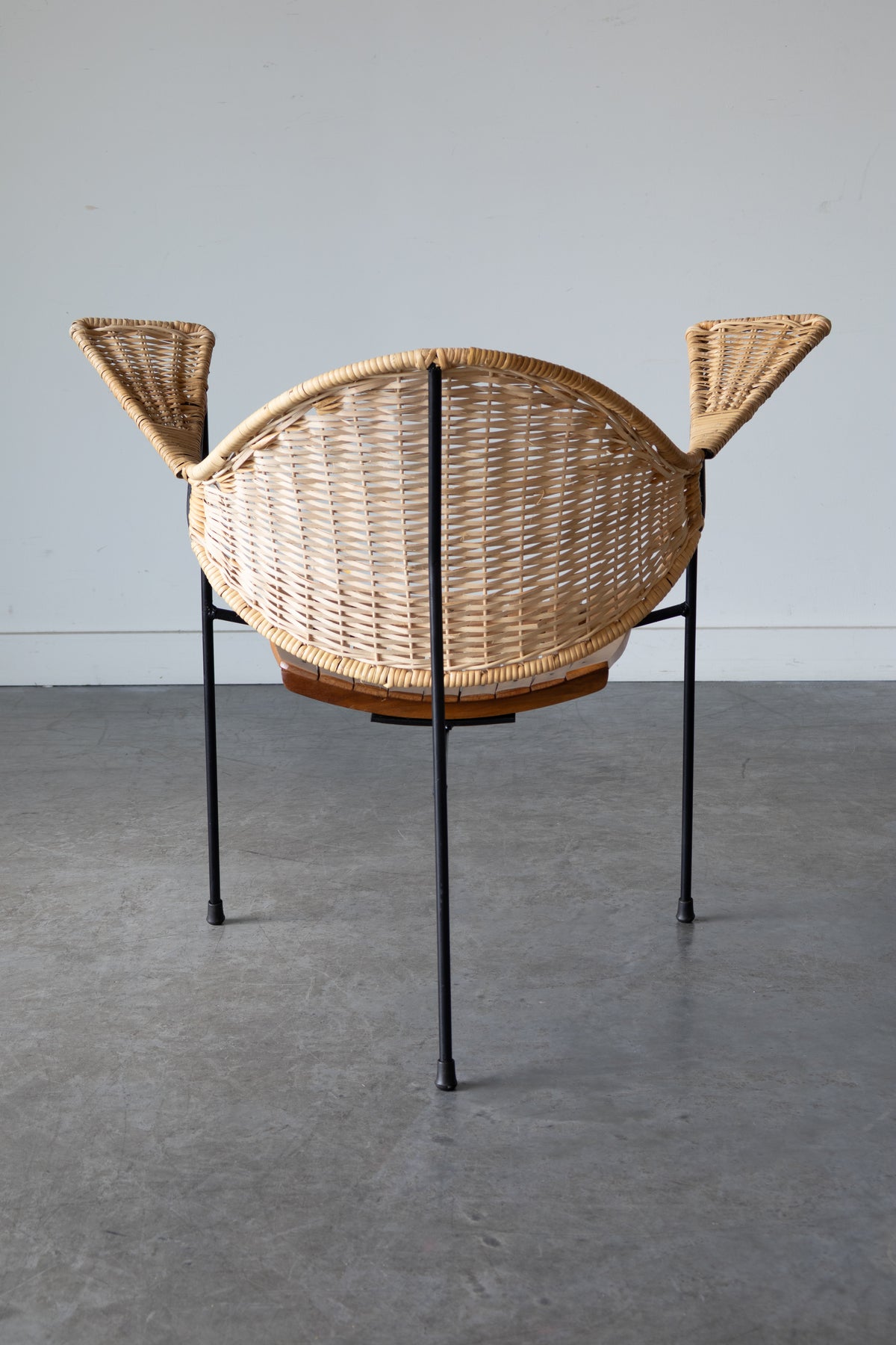 Cane and steel armchair and ottoman by Arthur Umanoff, 1955