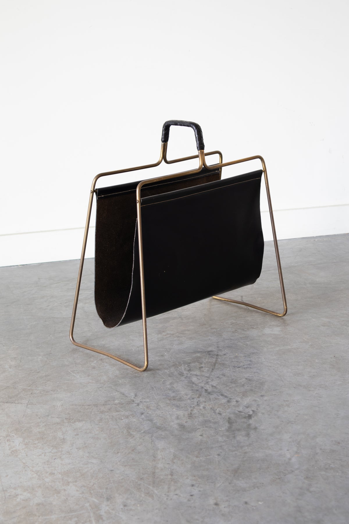 Brass and Leather magazine holder by Carl Auböck