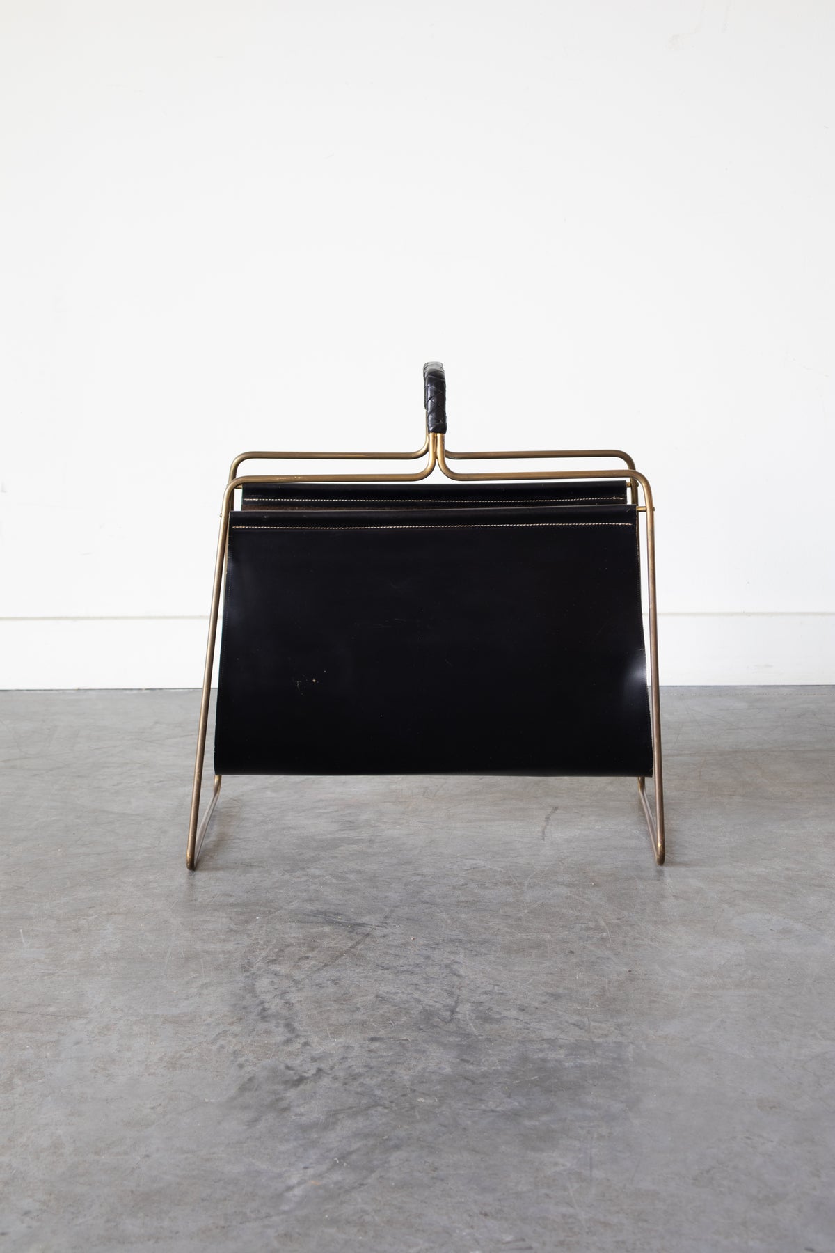 Brass and Leather magazine holder by Carl Auböck