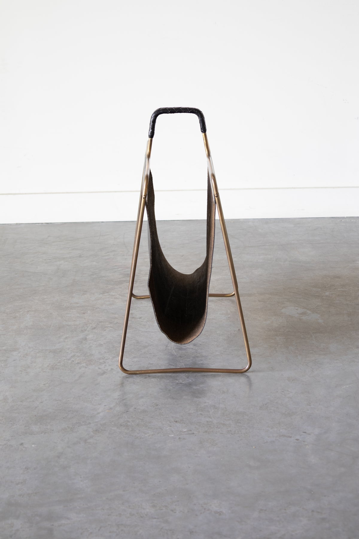 Brass and Leather magazine holder by Carl Auböck