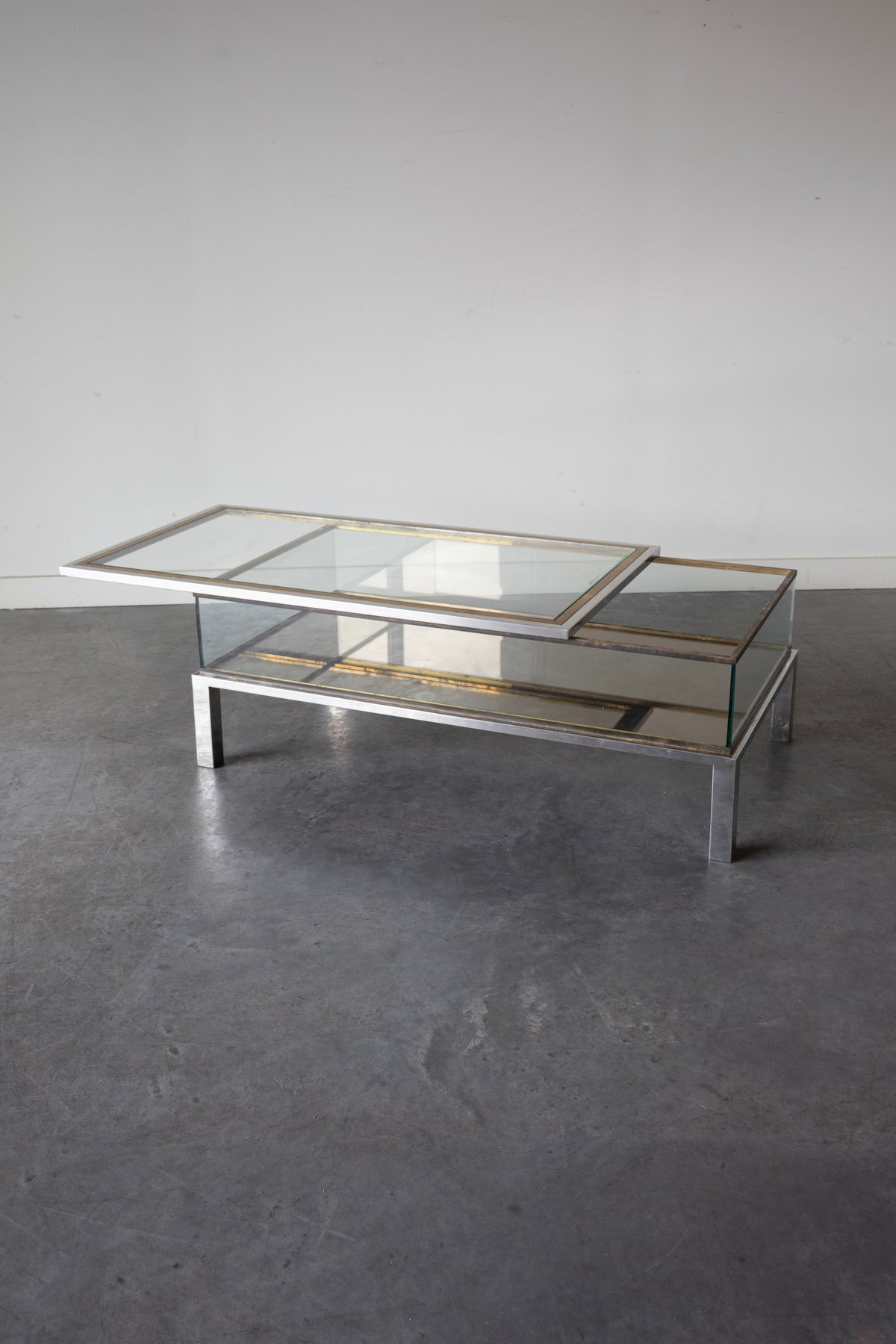 Brass and Chrome Sliding Top Coffee Table in by Maison Jansen