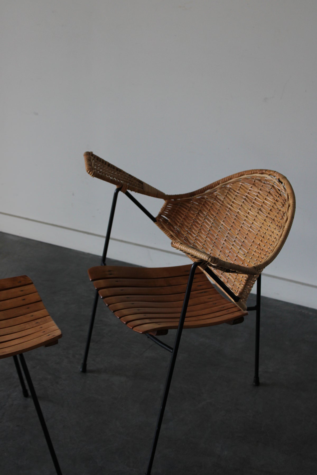Cane and steel armchair and ottoman by Arthur Umanoff, 1955
