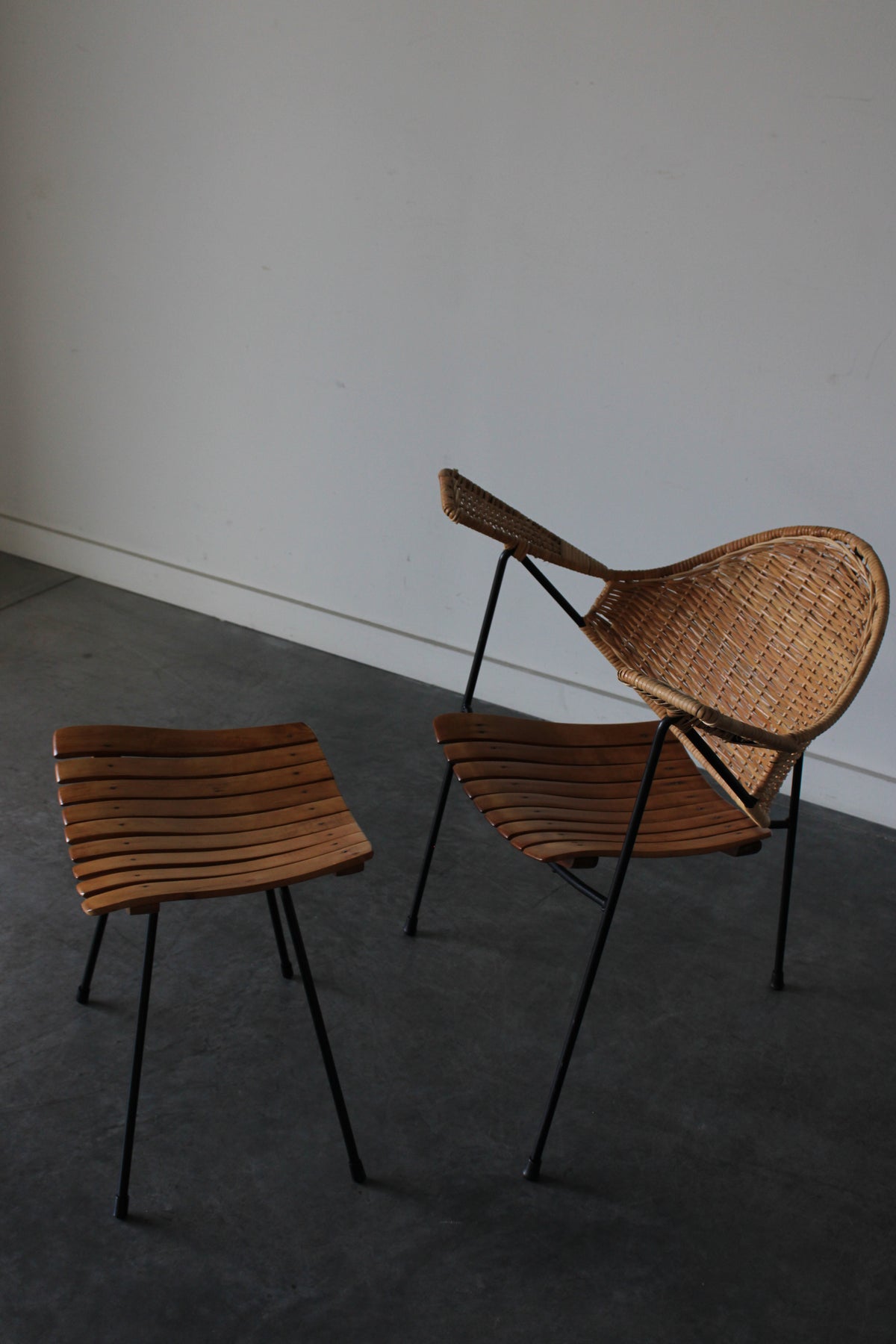 Cane and steel armchair and ottoman by Arthur Umanoff, 1955