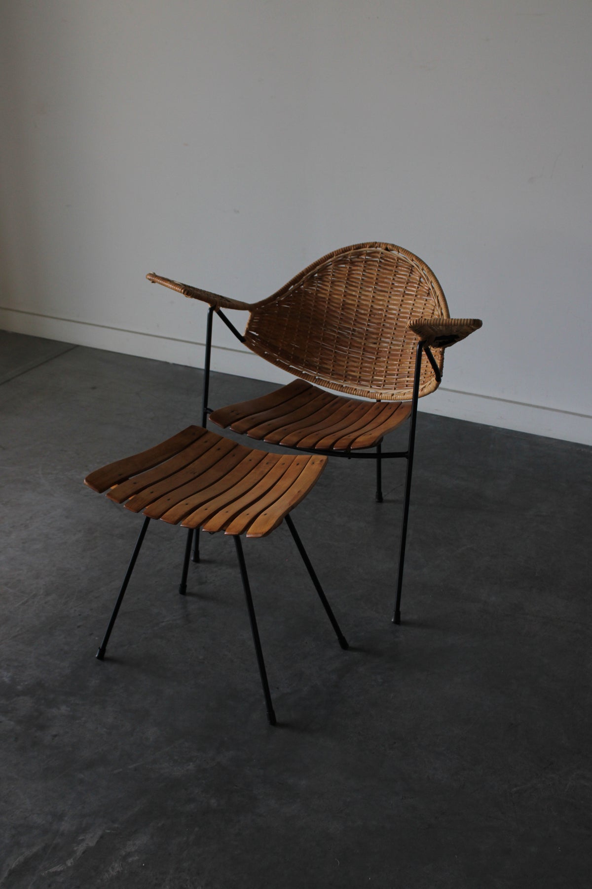 Cane and steel armchair and ottoman by Arthur Umanoff, 1955