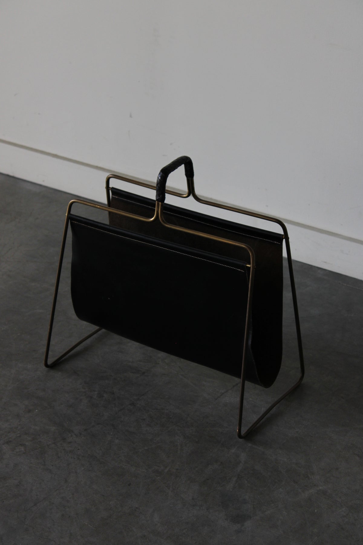 Brass and Leather magazine holder by Carl Auböck