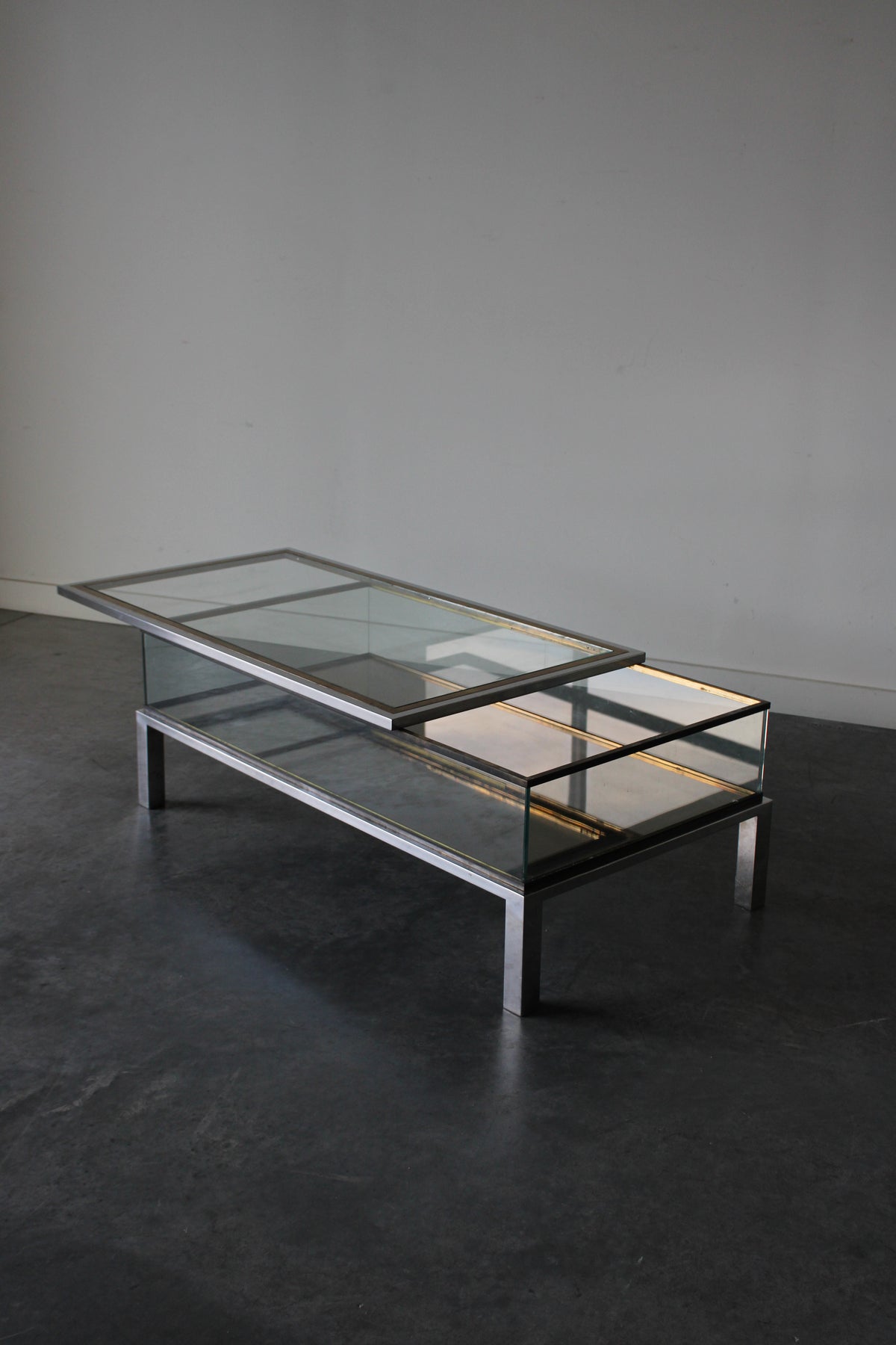 Brass and Chrome Sliding Top Coffee Table in by Maison Jansen